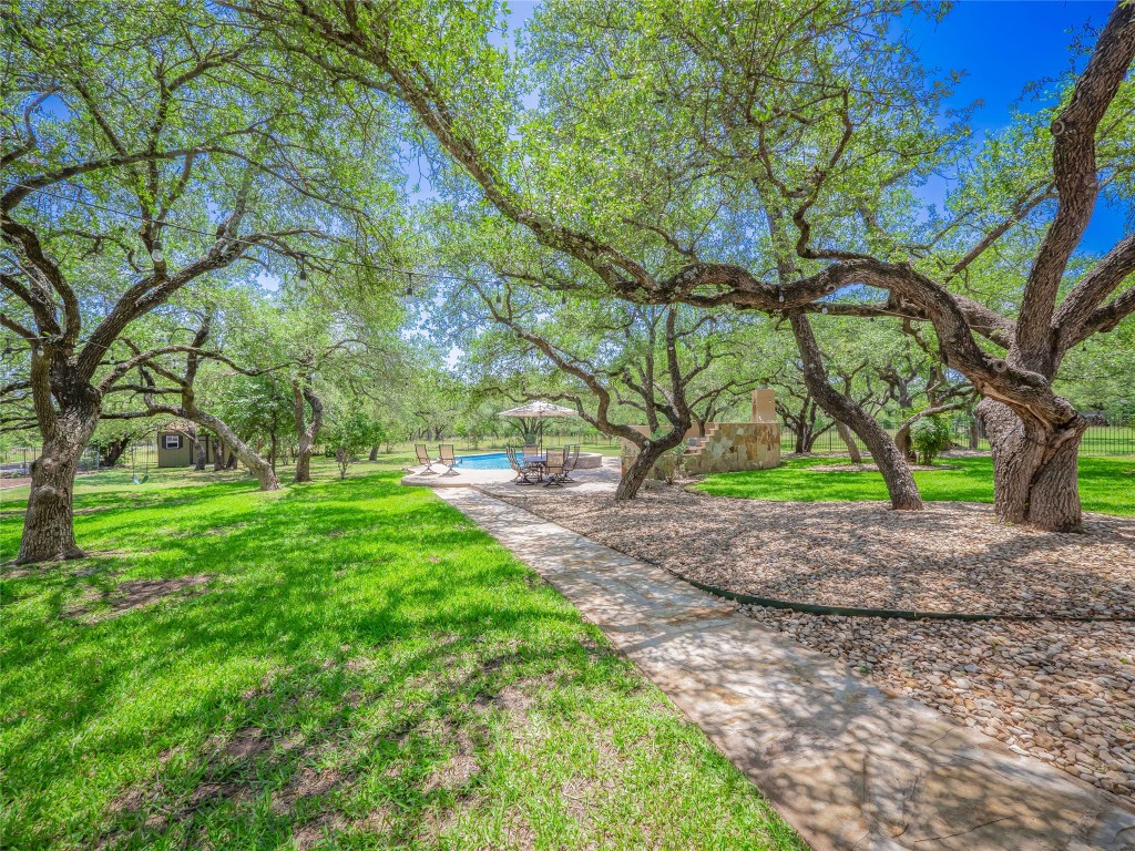 104 East Rustle Cove Georgetown, TX 78628 - Photo 31 of 40 a view of outdoor space with deck and trees