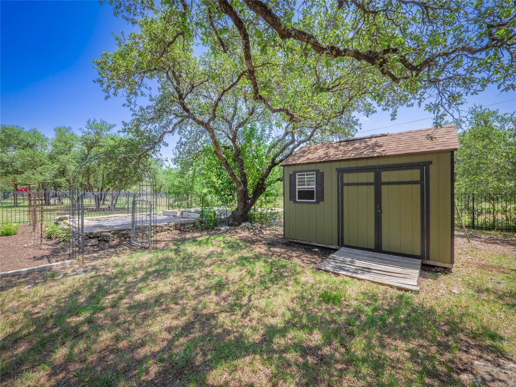 104 East Rustle Cove Georgetown, TX 78628 - Photo 34 of 40 a view of a house with a yard and tree