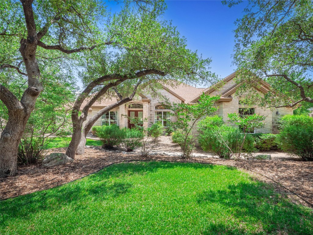 104 East Rustle Cove Georgetown, TX 78628 - Photo 40 of 40 a front view of a house with a yard and green space
