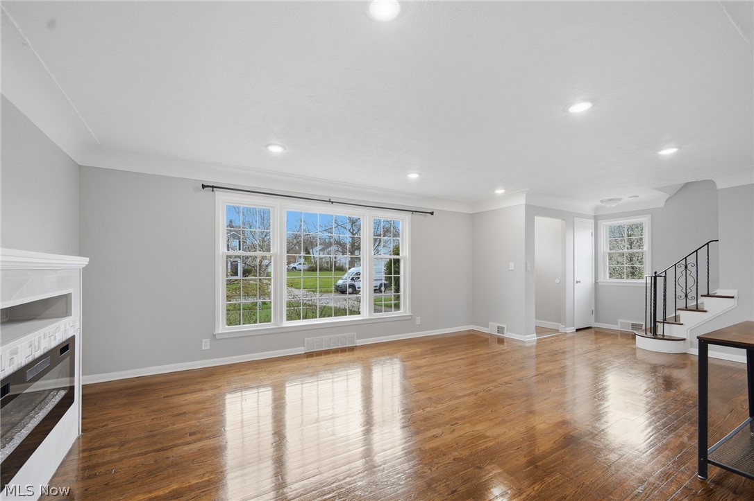3722 Lindholm Road Shaker Heights, OH 44120 - Photo 10 of 34 The living area features hardwood floors, a prominent window with multiple panes, and recessed lighting