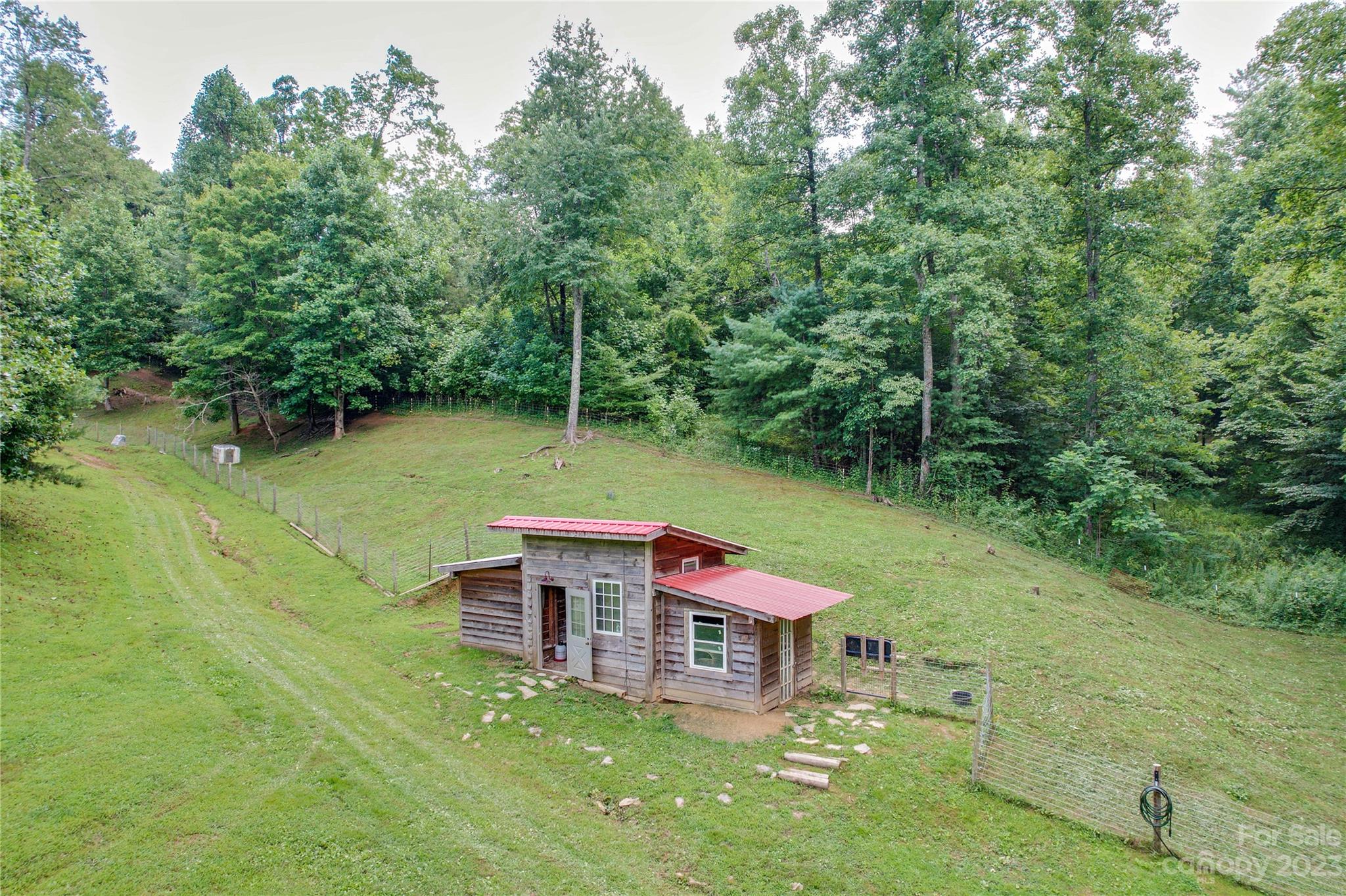3113 Revere Road Marshall, NC 28753 - Photo 14 of 47 a view of a chairs in a backyard of a house
