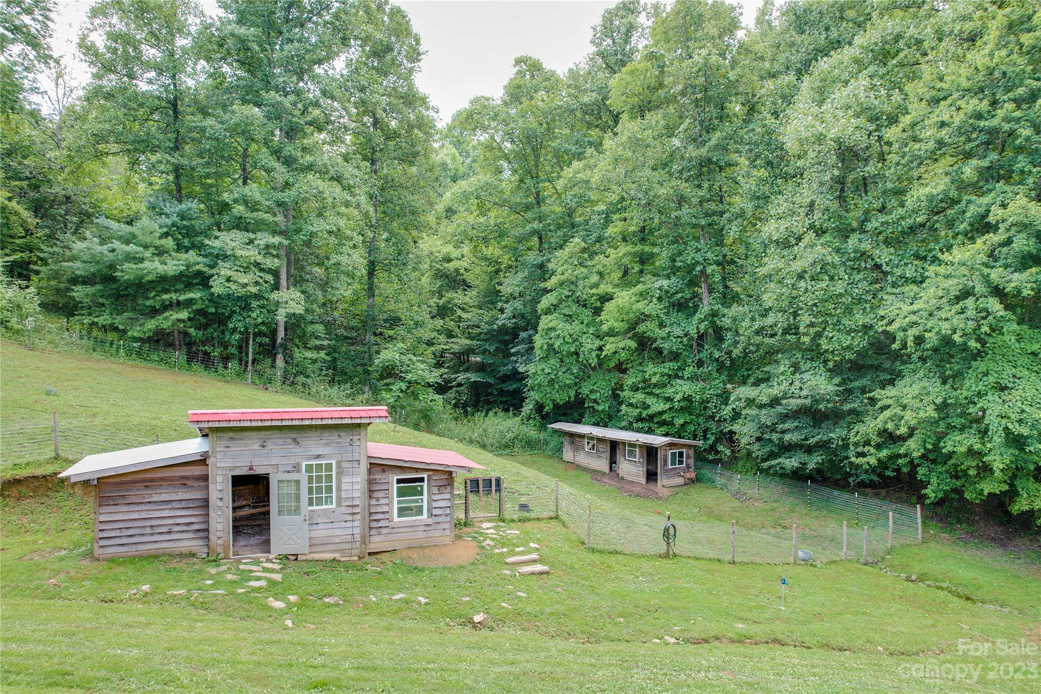 3113 Revere Road Marshall, NC 28753 - Photo 15 of 47 a front view of a house with a garden