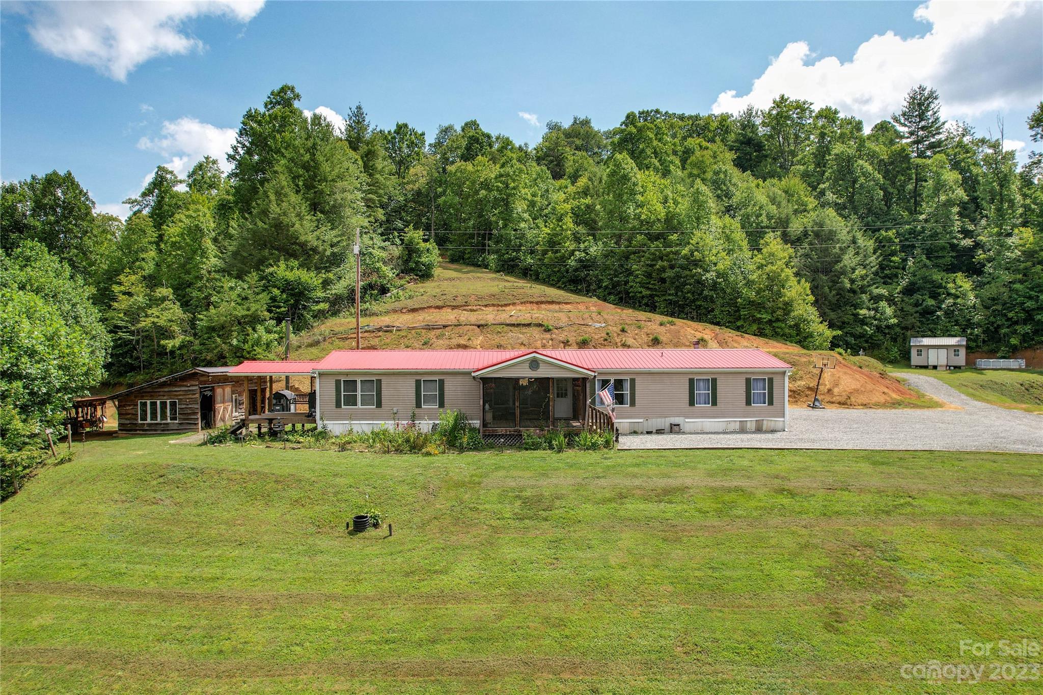 3113 Revere Road Marshall, NC 28753 - Photo 20 of 47 a view of a house with a big yard