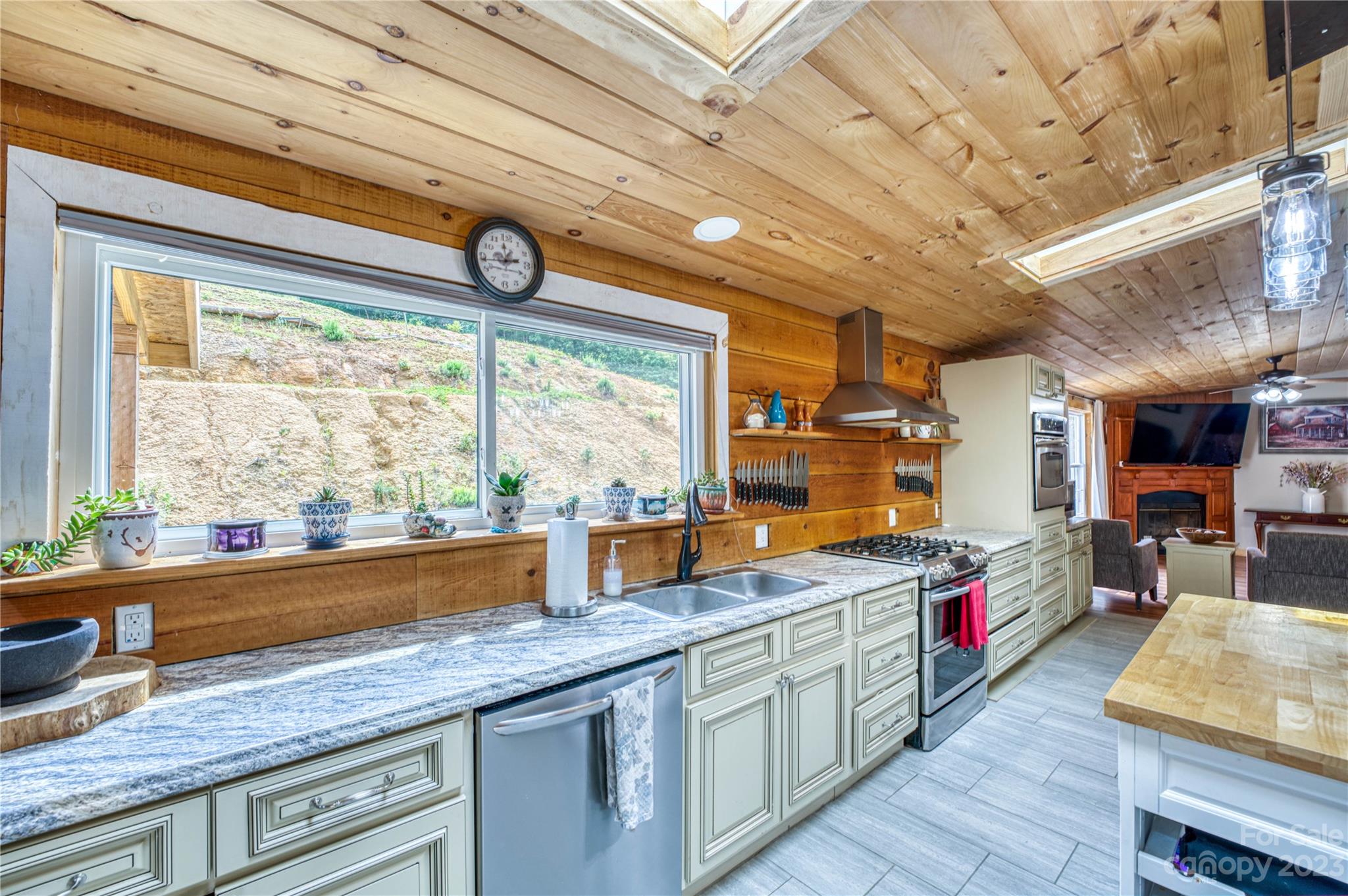3113 Revere Road Marshall, NC 28753 - Photo 24 of 47 a very nice looking kitchen with granite countertop a large window