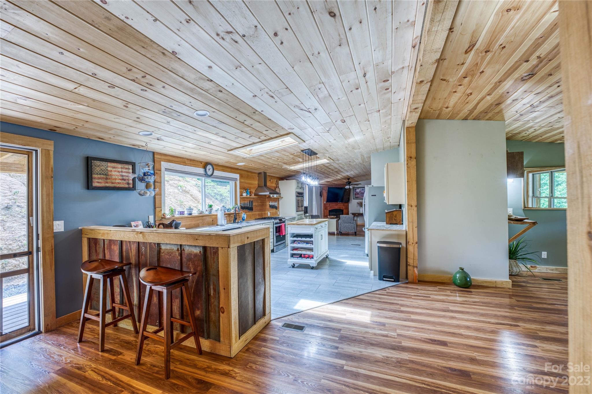 3113 Revere Road Marshall, NC 28753 - Photo 26 of 47 a view of a dining room with furniture window and wooden floor