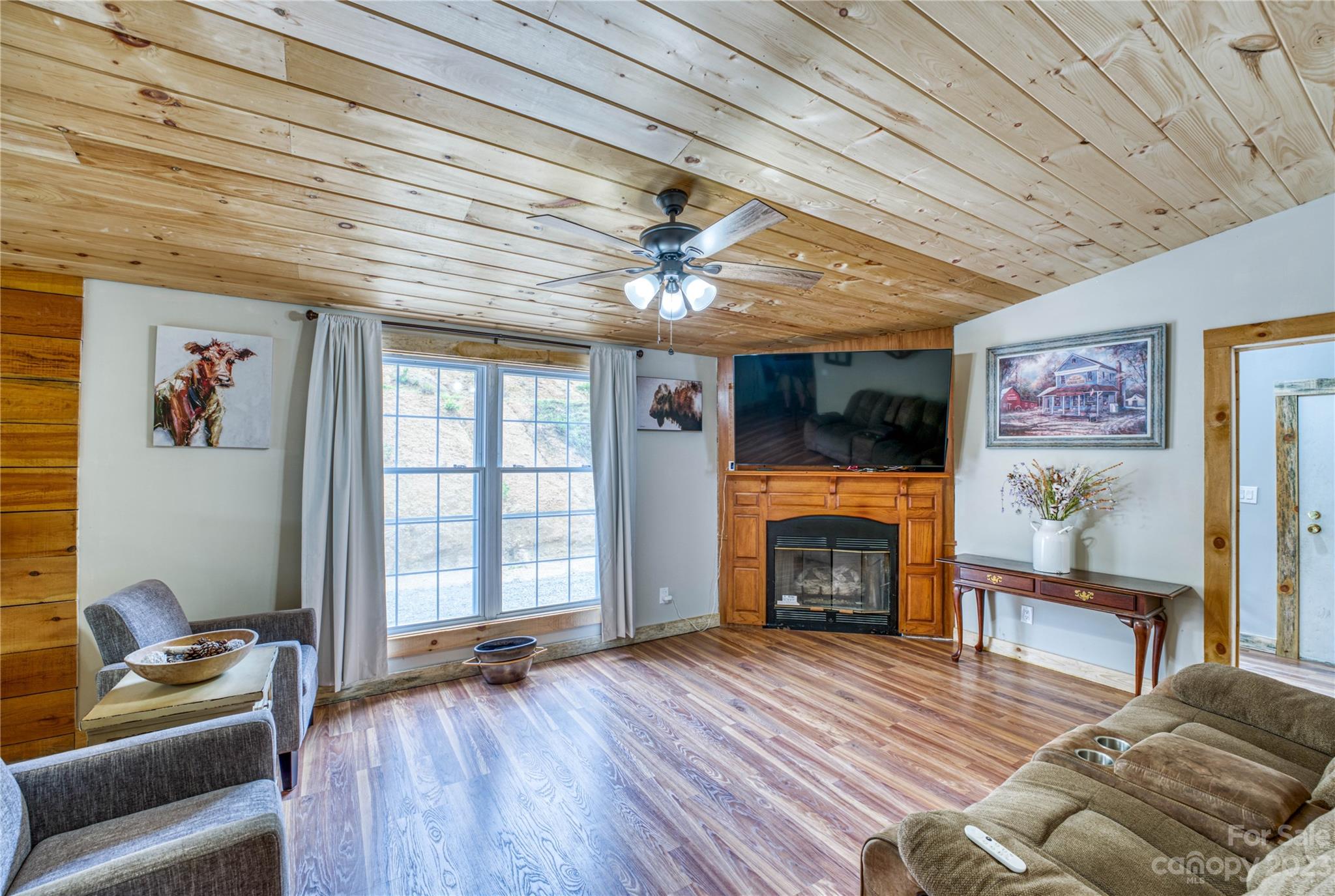 3113 Revere Road Marshall, NC 28753 - Photo 29 of 47 a living room with furniture and a fireplace