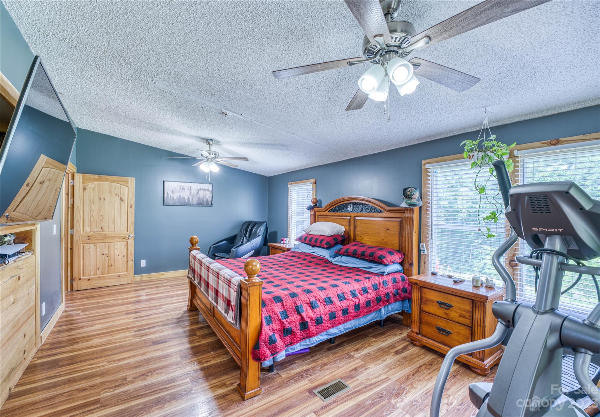 3113 Revere Road Marshall, NC 28753 - Photo 30 of 47 a bedroom with a bed and wooden floor