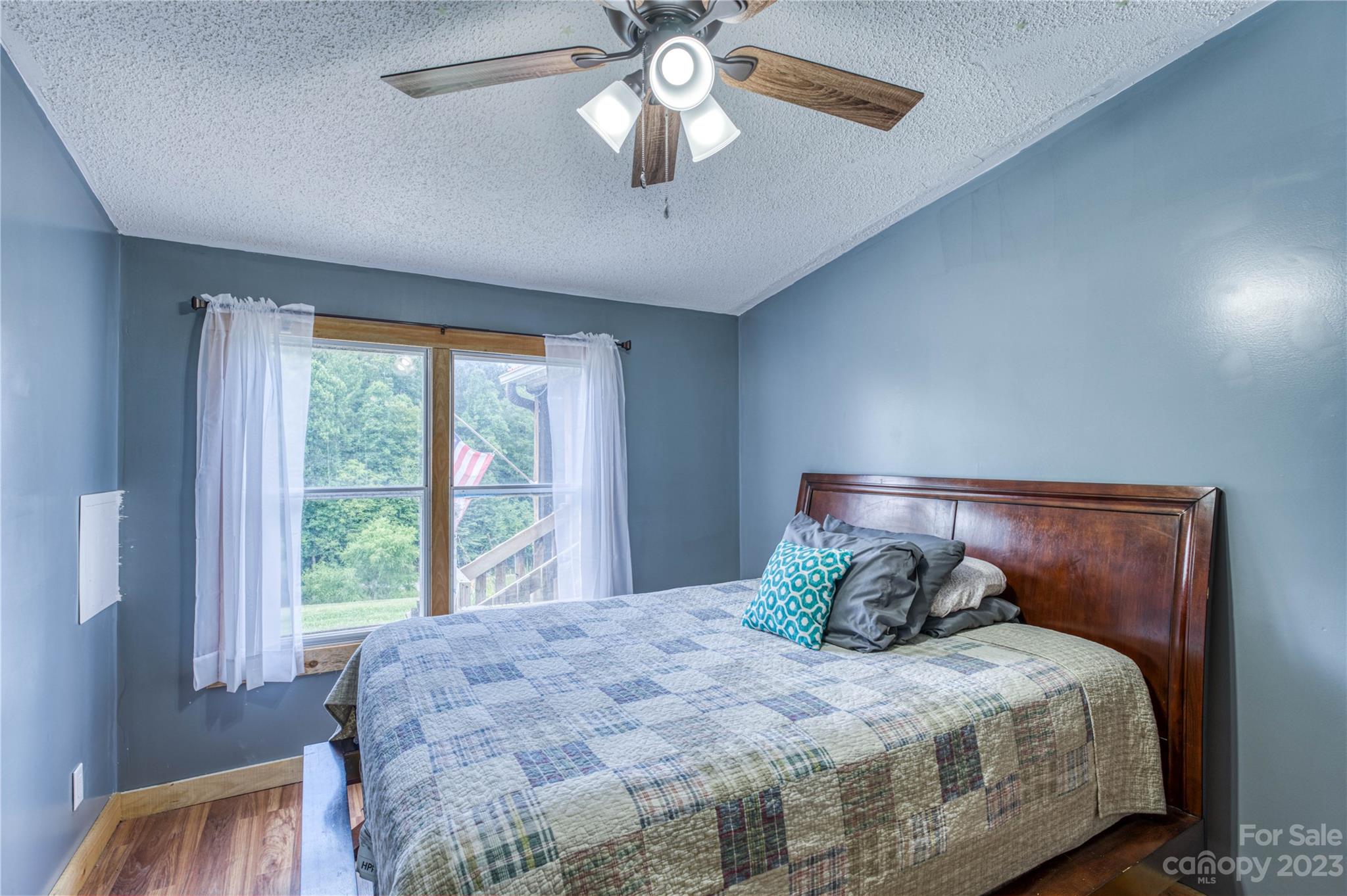 3113 Revere Road Marshall, NC 28753 - Photo 33 of 47 a bedroom with a bed and window