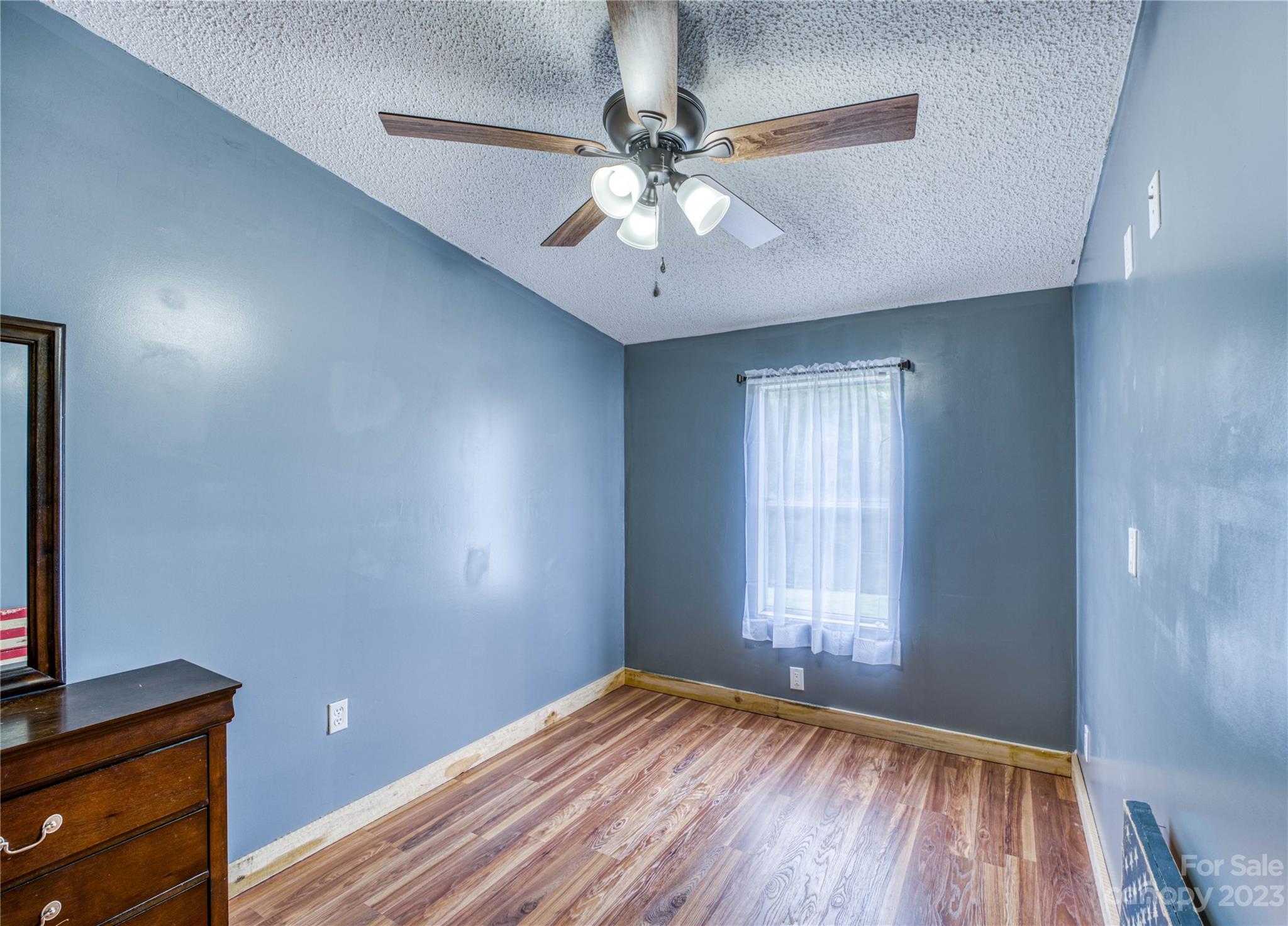 3113 Revere Road Marshall, NC 28753 - Photo 34 of 47 wooden floor in an empty room with a window