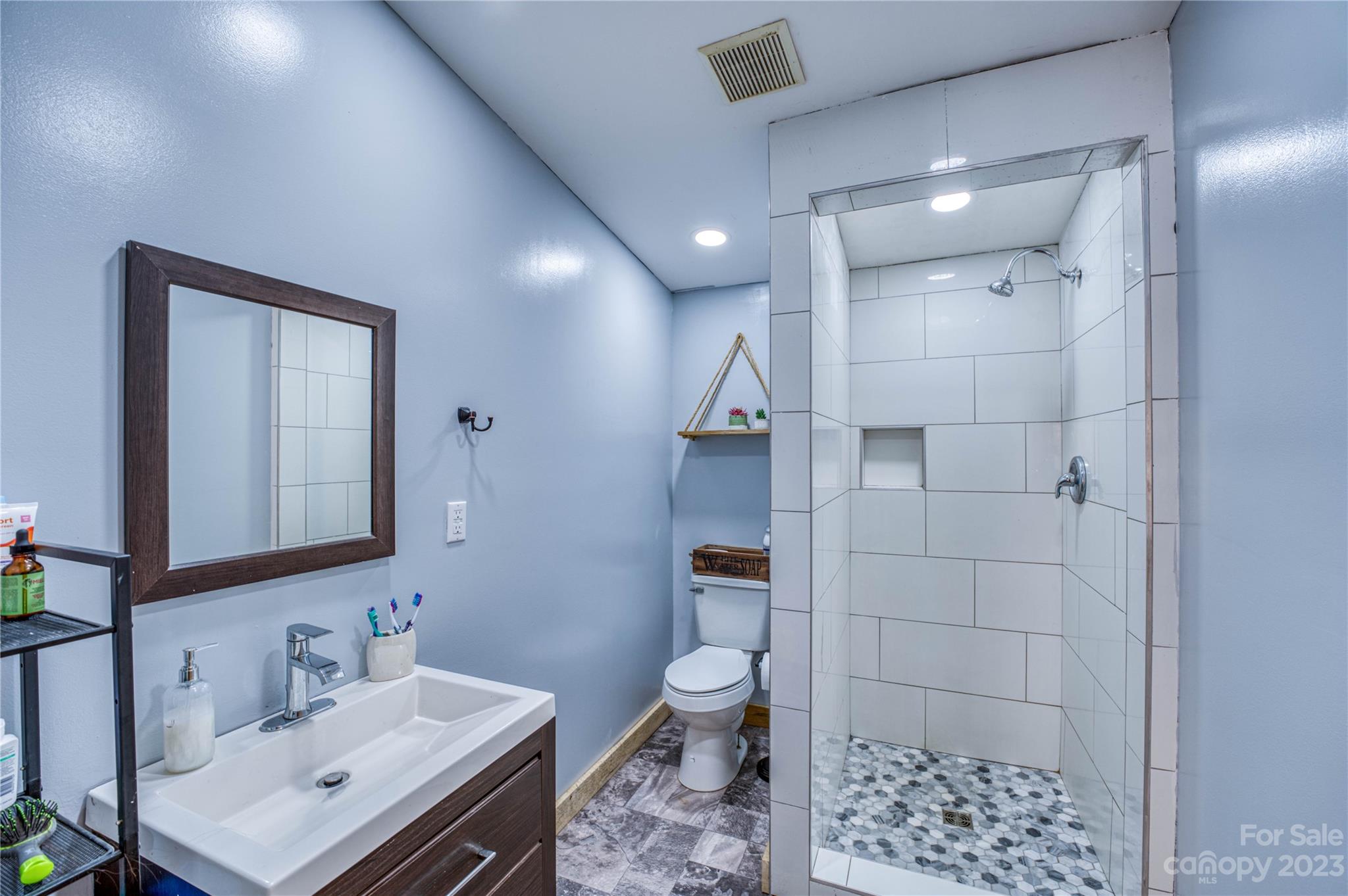 3113 Revere Road Marshall, NC 28753 - Photo 35 of 47 a bathroom with a sink toilet and shower