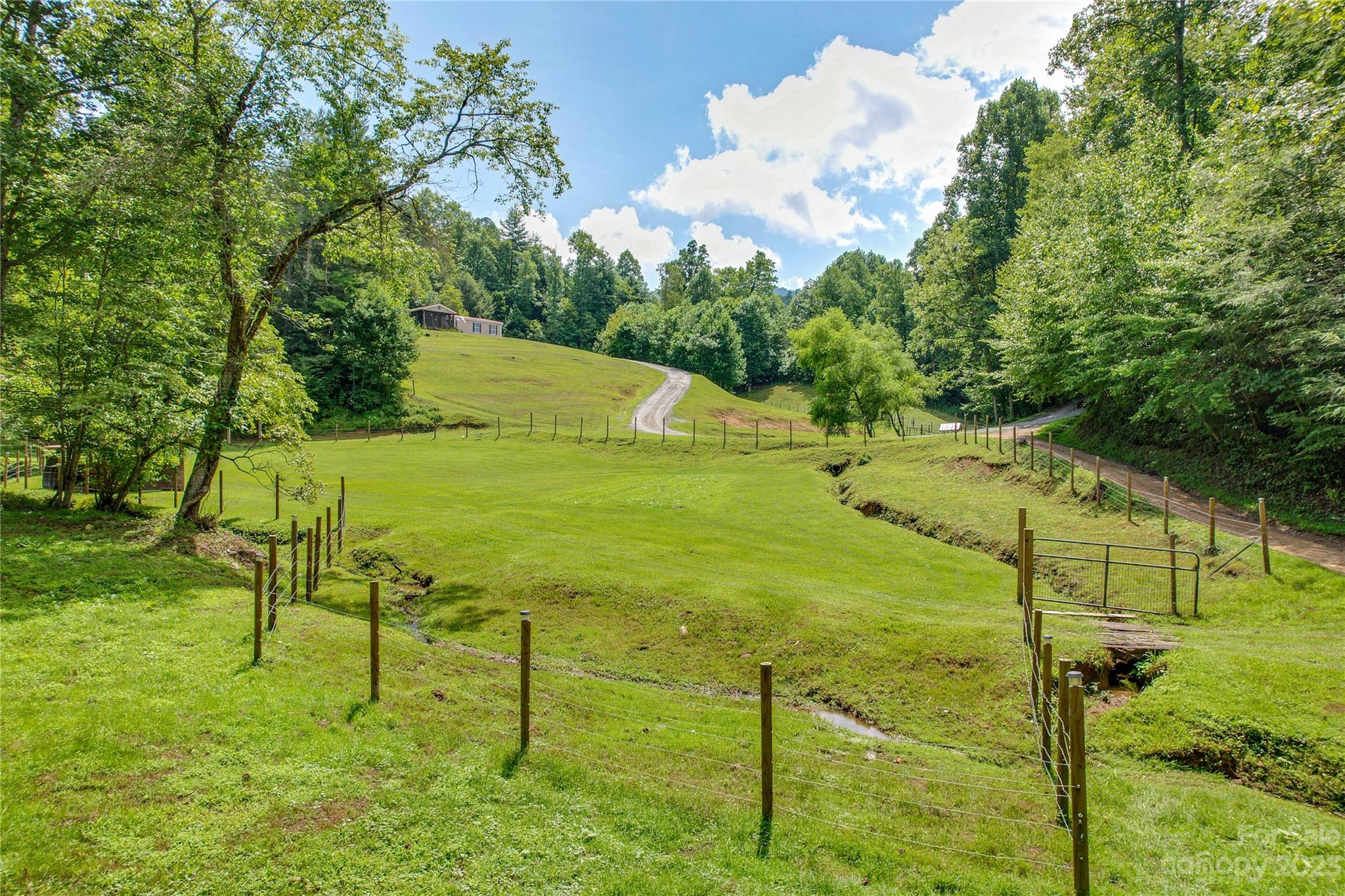 3113 Revere Road Marshall, NC 28753 - Photo 6 of 47 a view of an outdoor space and basketball court