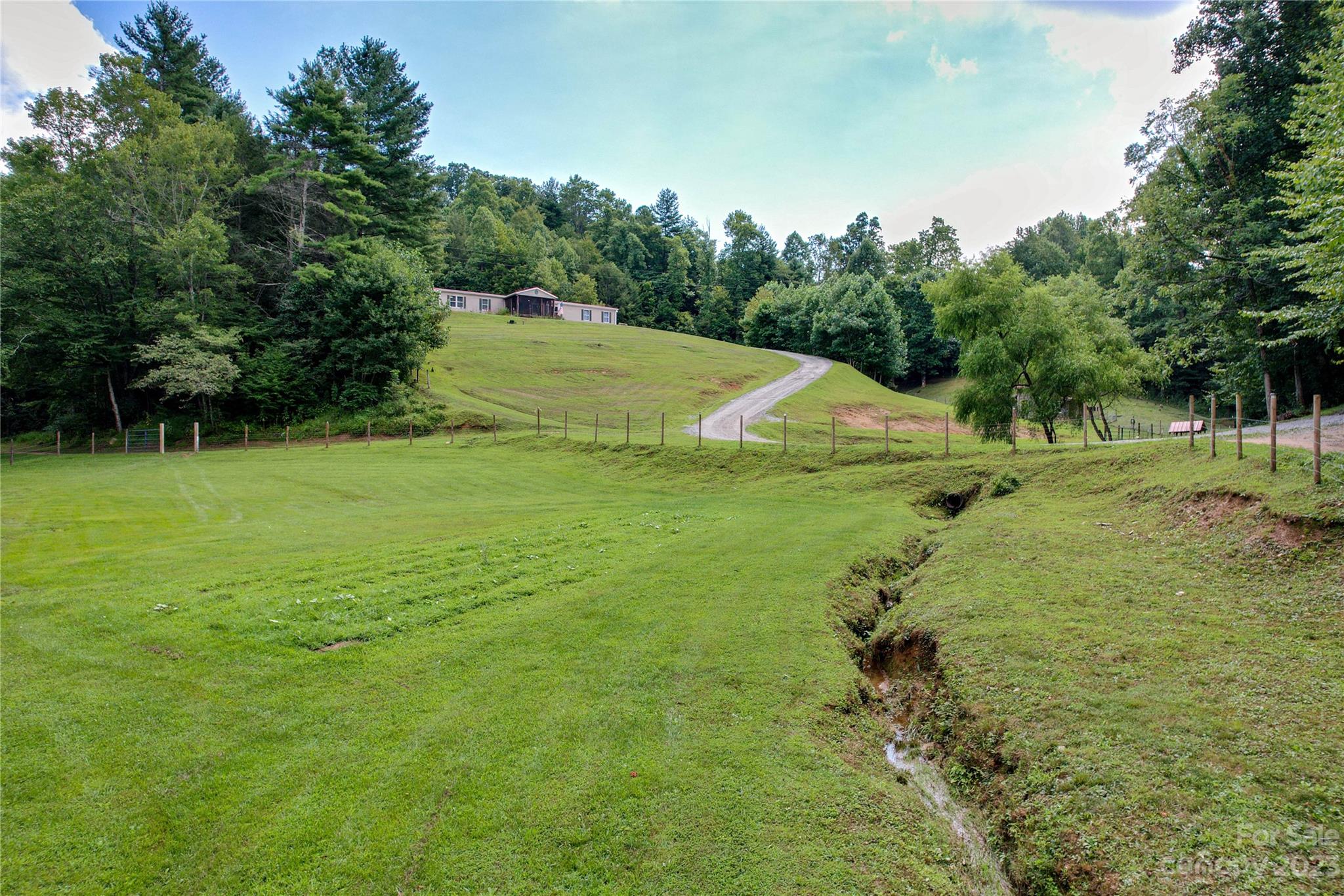 3113 Revere Road Marshall, NC 28753 - Photo 7 of 47 a view of a golf course with a trees