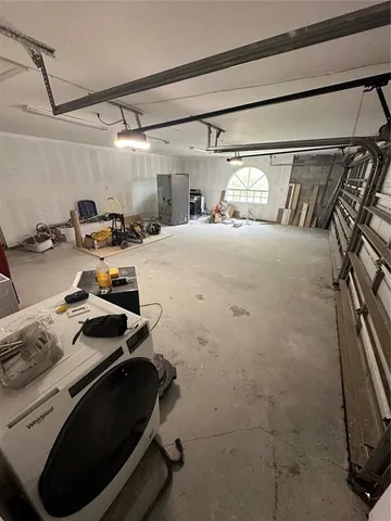 a bedroom with a bed and a mirror