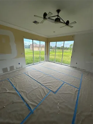 a view of an empty room and window