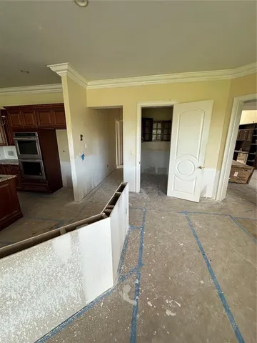 a view of a kitchen with car parked