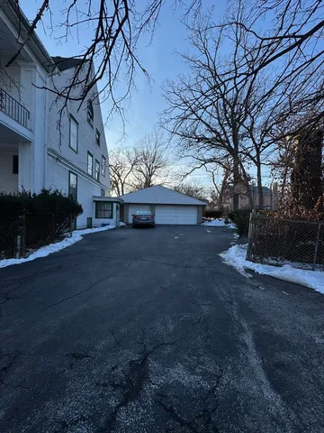 a living room with lots of furniture and a fireplace