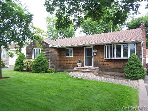 7 Martin Road South Bethpage, NY 11714 - Photo 1 of 1 a front view of a house with a yard