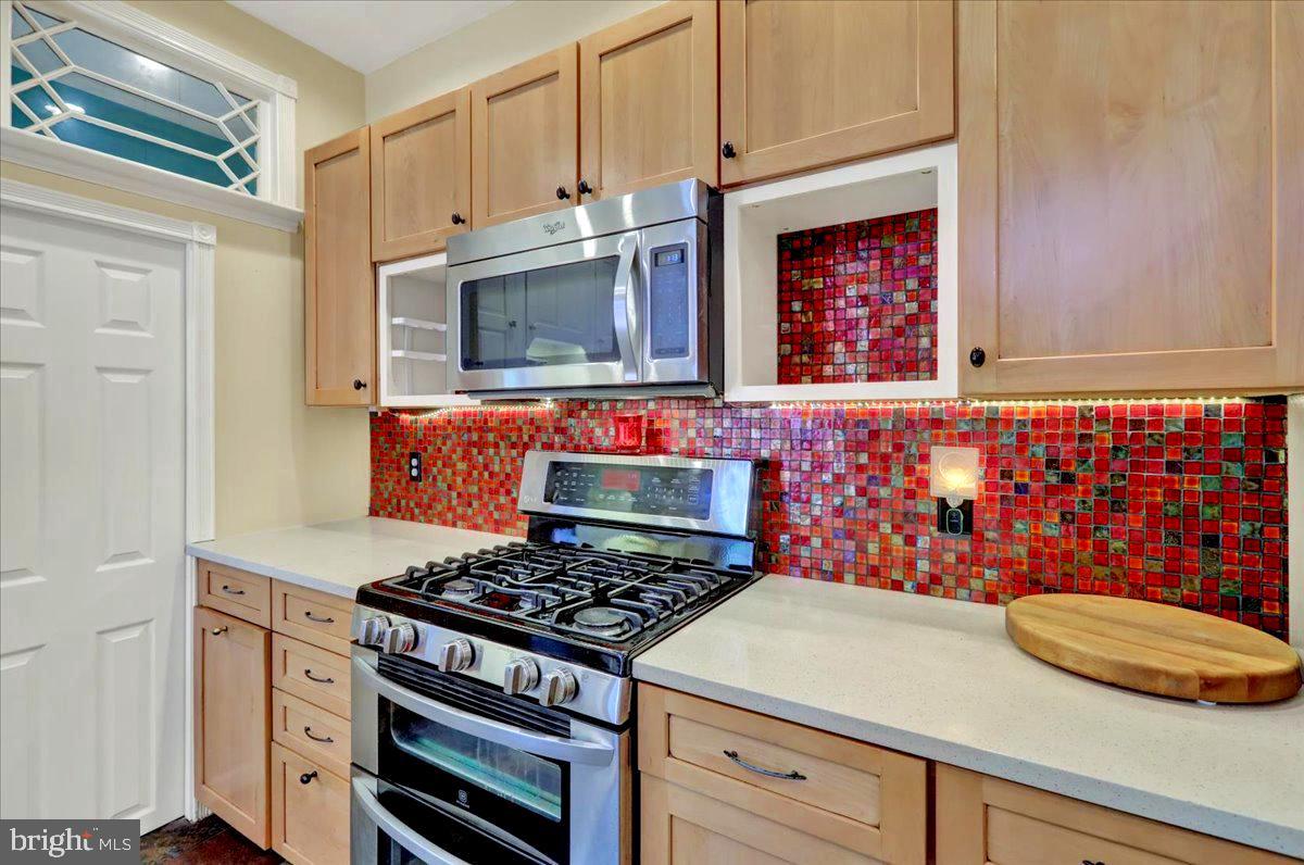 315 Nevin Street Lancaster, PA 17603 - Photo 13 of 41 a kitchen with stainless steel appliances a stove and a microwave