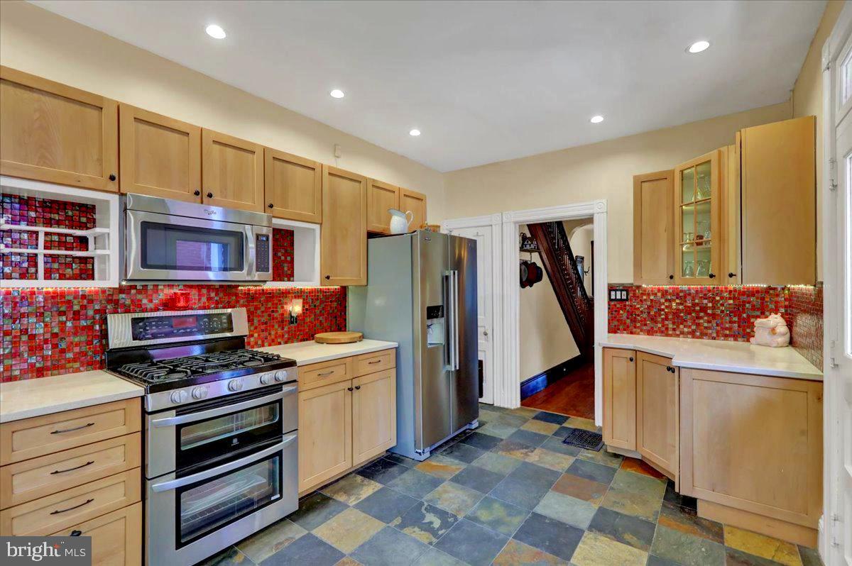 315 Nevin Street Lancaster, PA 17603 - Photo 15 of 41 a kitchen that has a lot of cabinets in it and wooden floors