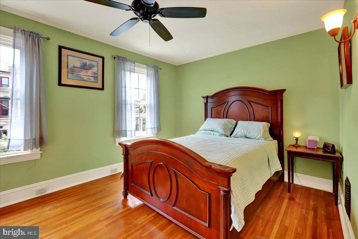 315 Nevin Street Lancaster, PA 17603 - Photo 20 of 41 a bedroom with a bed and wooden floor