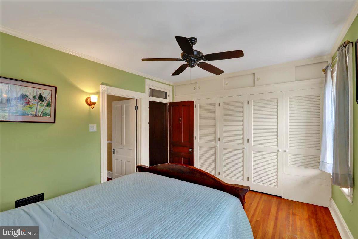 315 Nevin Street Lancaster, PA 17603 - Photo 21 of 41 a bedroom with a bed and a chandelier