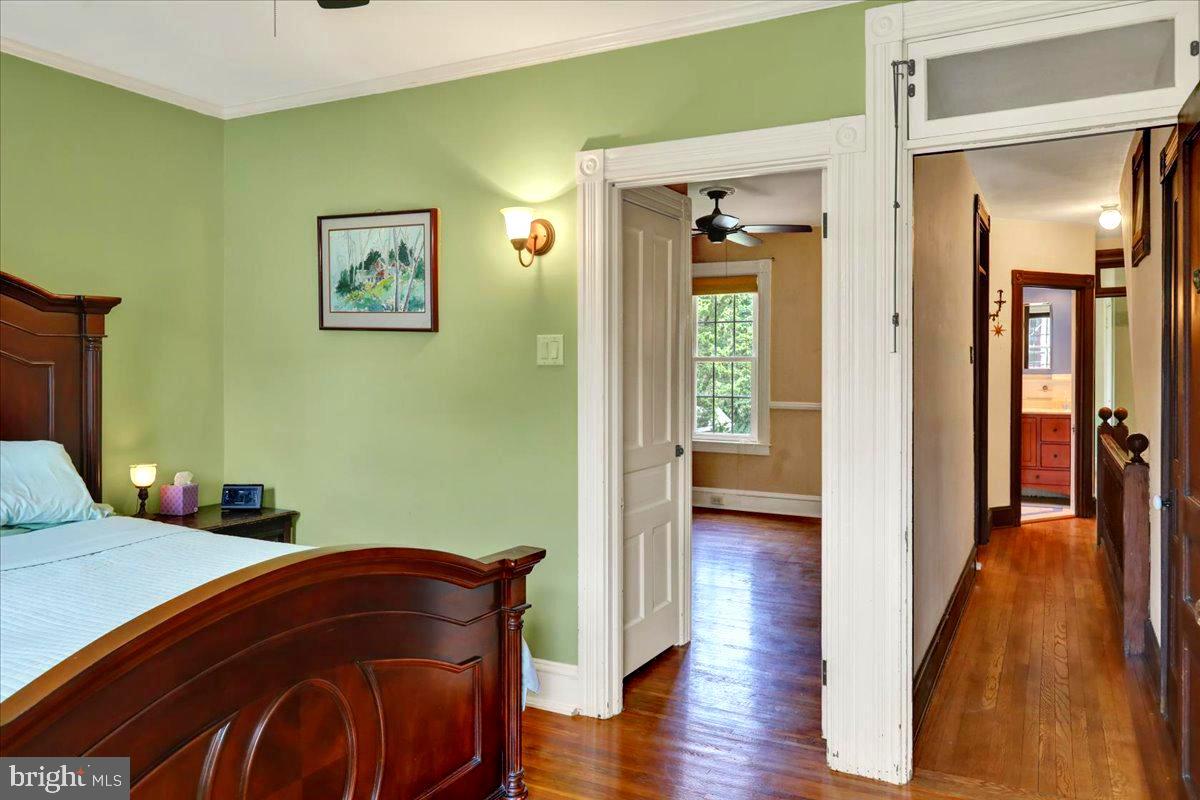 315 Nevin Street Lancaster, PA 17603 - Photo 22 of 41 a bedroom with a bed and wooden floor