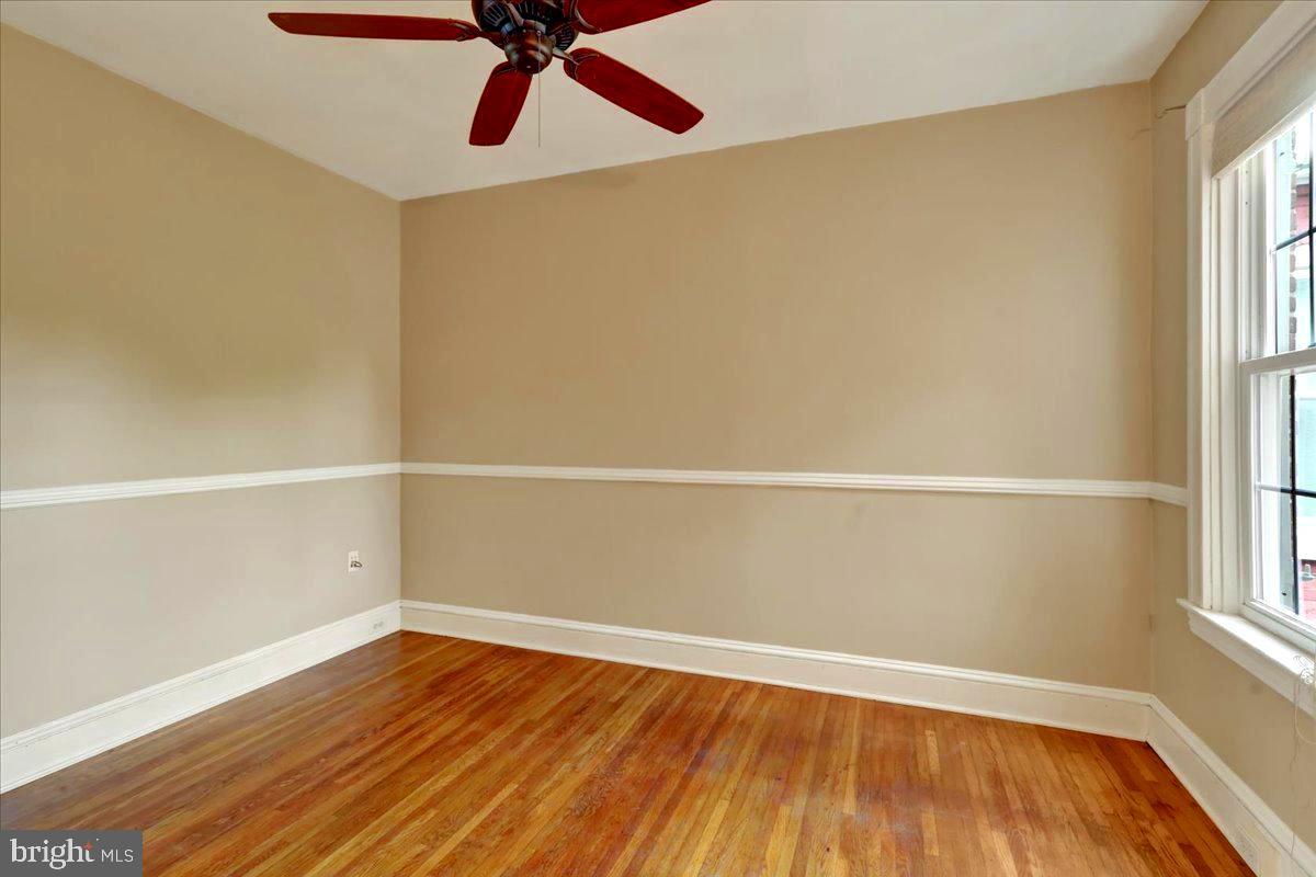 315 Nevin Street Lancaster, PA 17603 - Photo 24 of 41 an empty room with wooden floor and windows