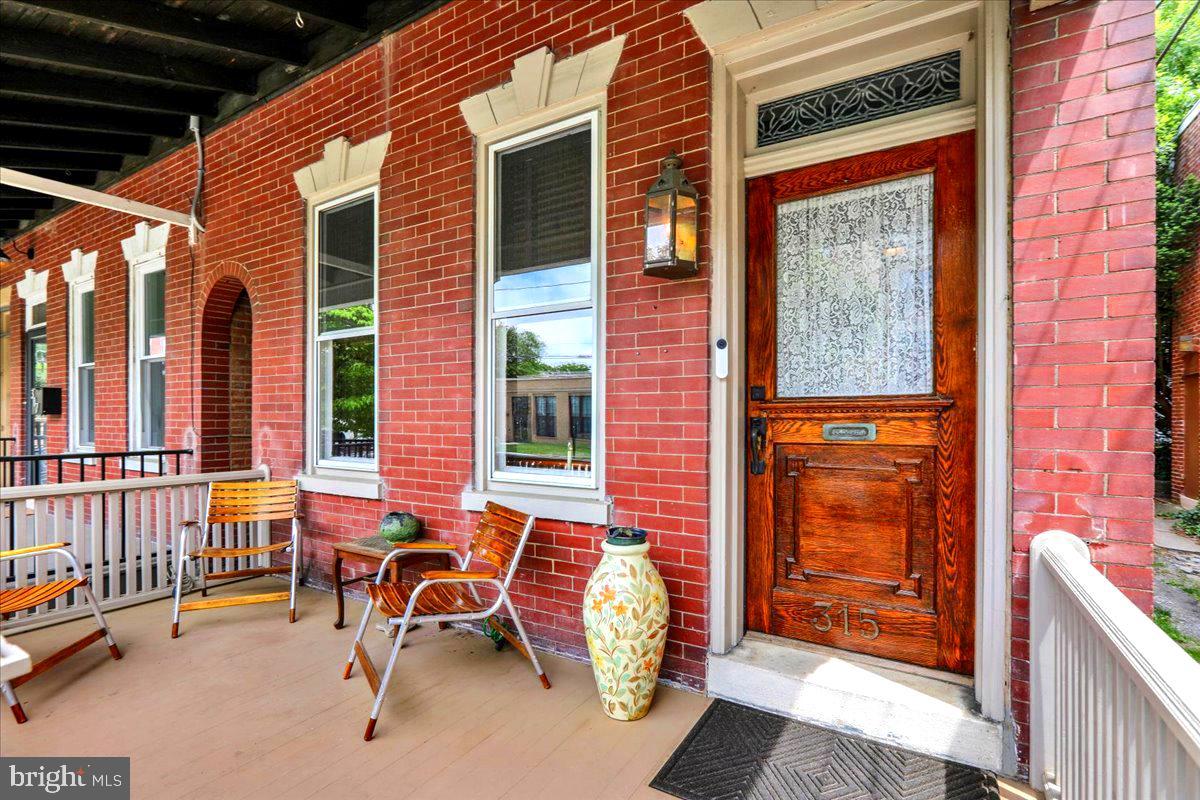 315 Nevin Street Lancaster, PA 17603 - Photo 3 of 41 a balcony with furniture and next to a window
