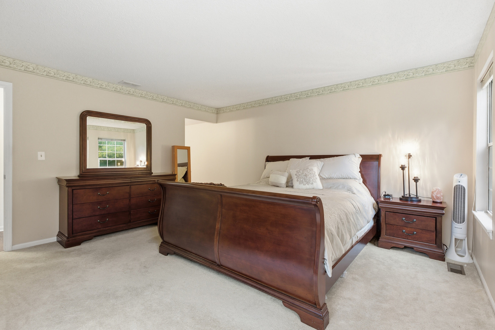 1411 Clybourne Street, Unit 11E Batavia, IL 60510 - Photo 13 of 34 a spacious bedroom with a bed and a window