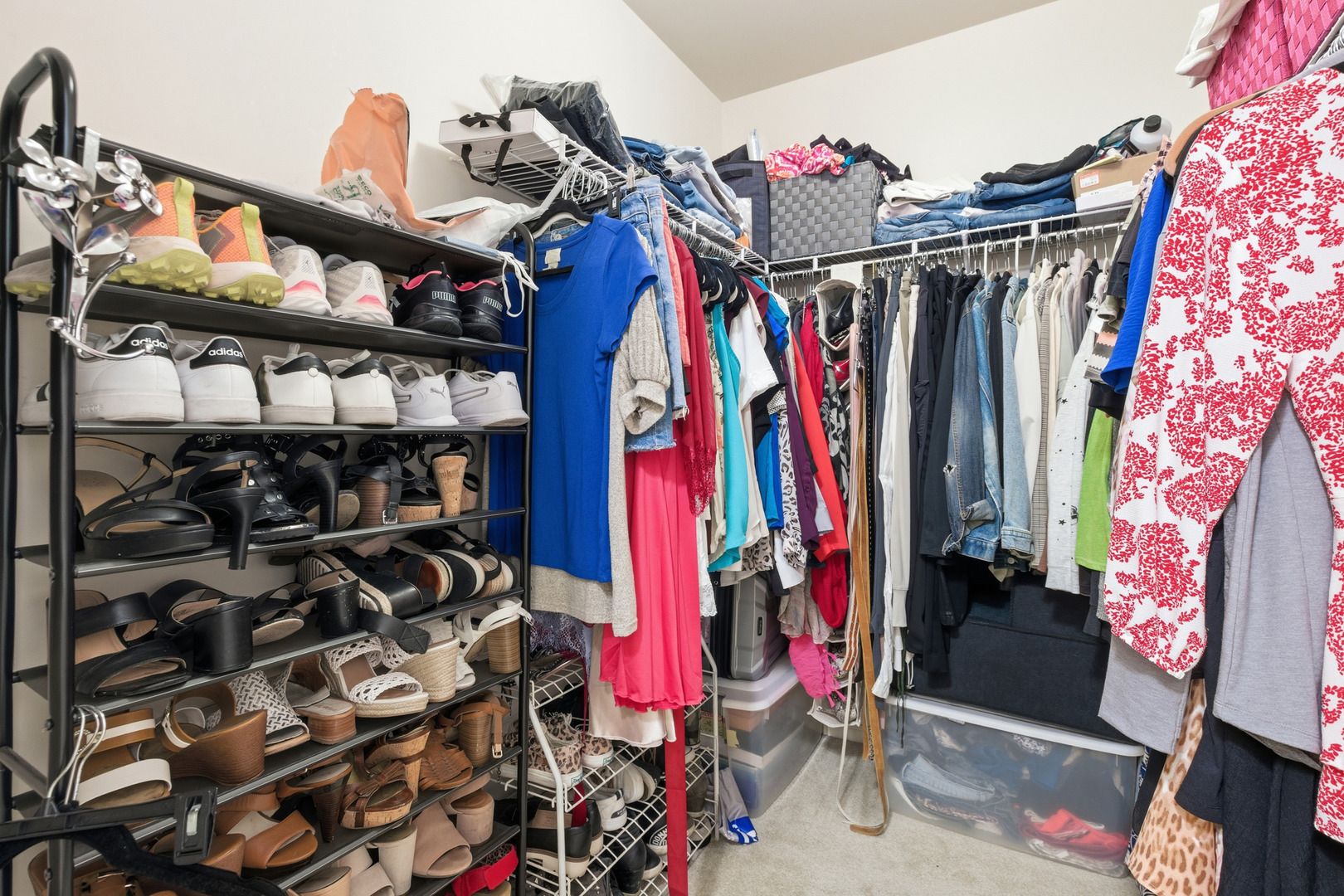 1411 Clybourne Street, Unit 11E Batavia, IL 60510 - Photo 16 of 34 a view of walk in closet with clothes