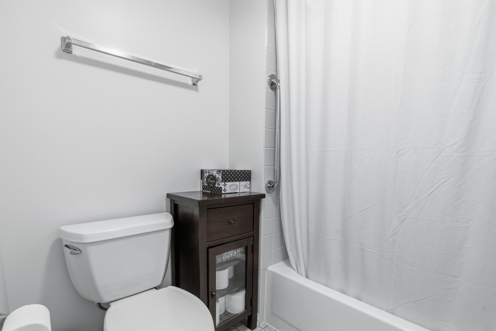1411 Clybourne Street, Unit 11E Batavia, IL 60510 - Photo 25 of 34 a white toilet sitting next to a bathroom sink