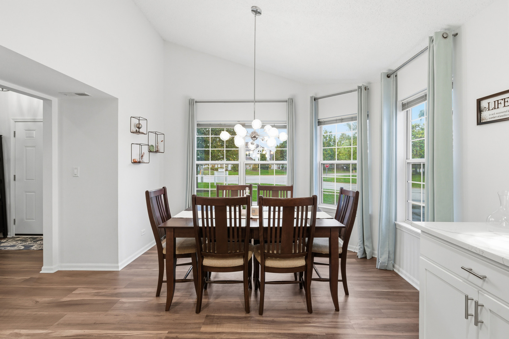1411 Clybourne Street, Unit 11E Batavia, IL 60510 - Photo 4 of 34 a view of a dining room with furniture window and wooden floor
