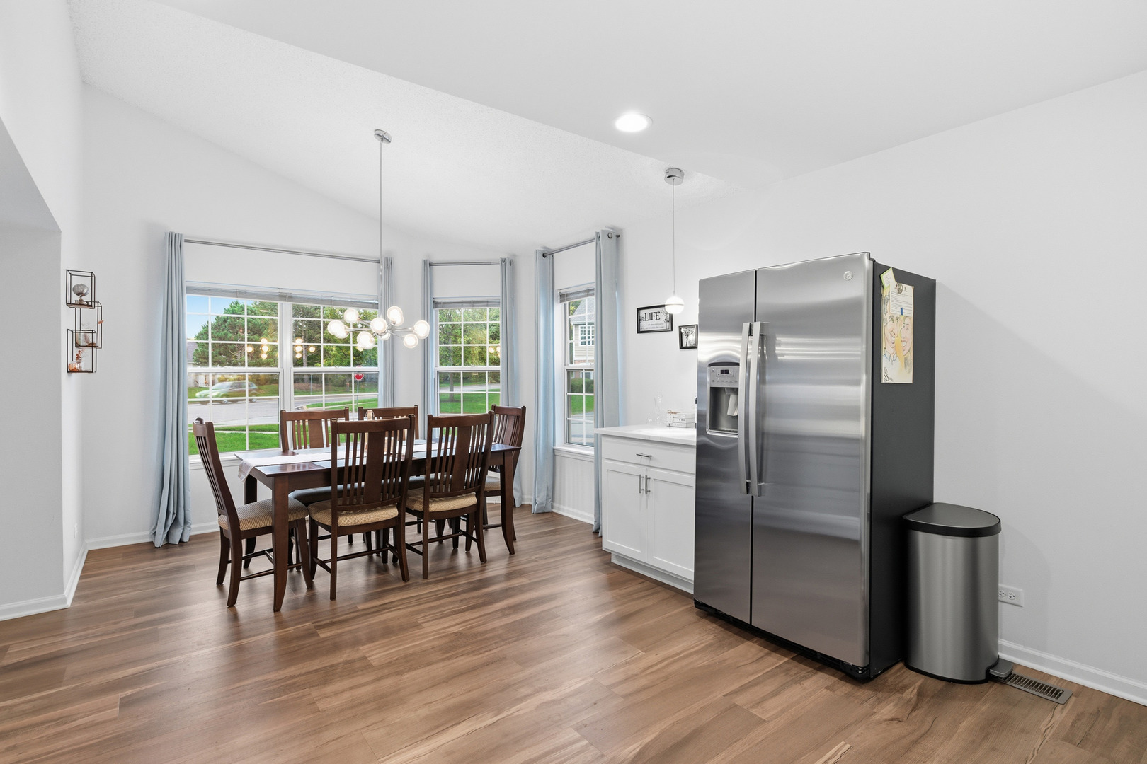 1411 Clybourne Street, Unit 11E Batavia, IL 60510 - Photo 5 of 34 a view of a dining room with furniture window and wooden floor