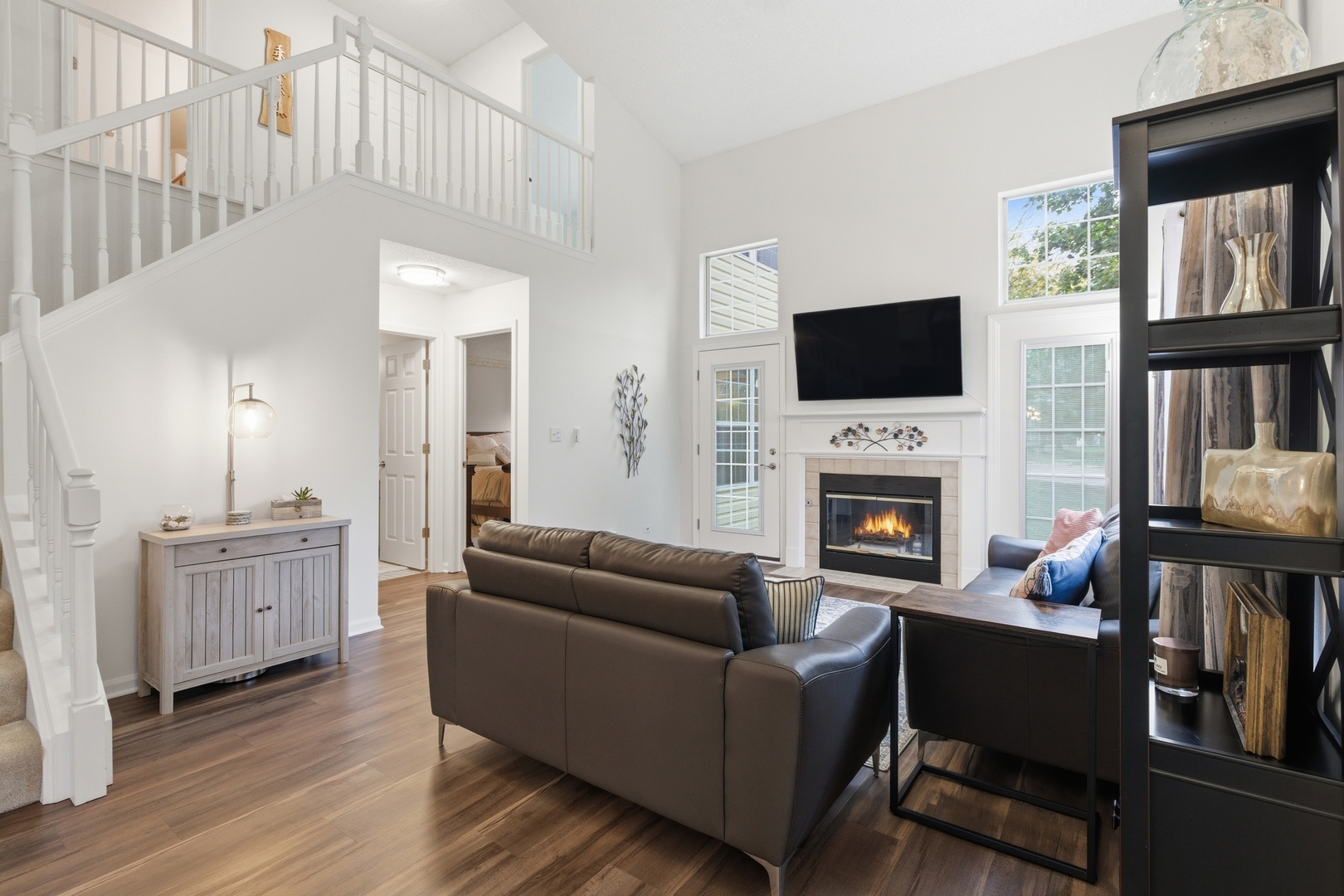 1411 Clybourne Street, Unit 11E Batavia, IL 60510 - Photo 9 of 34 a living room with furniture fireplace and flat screen tv