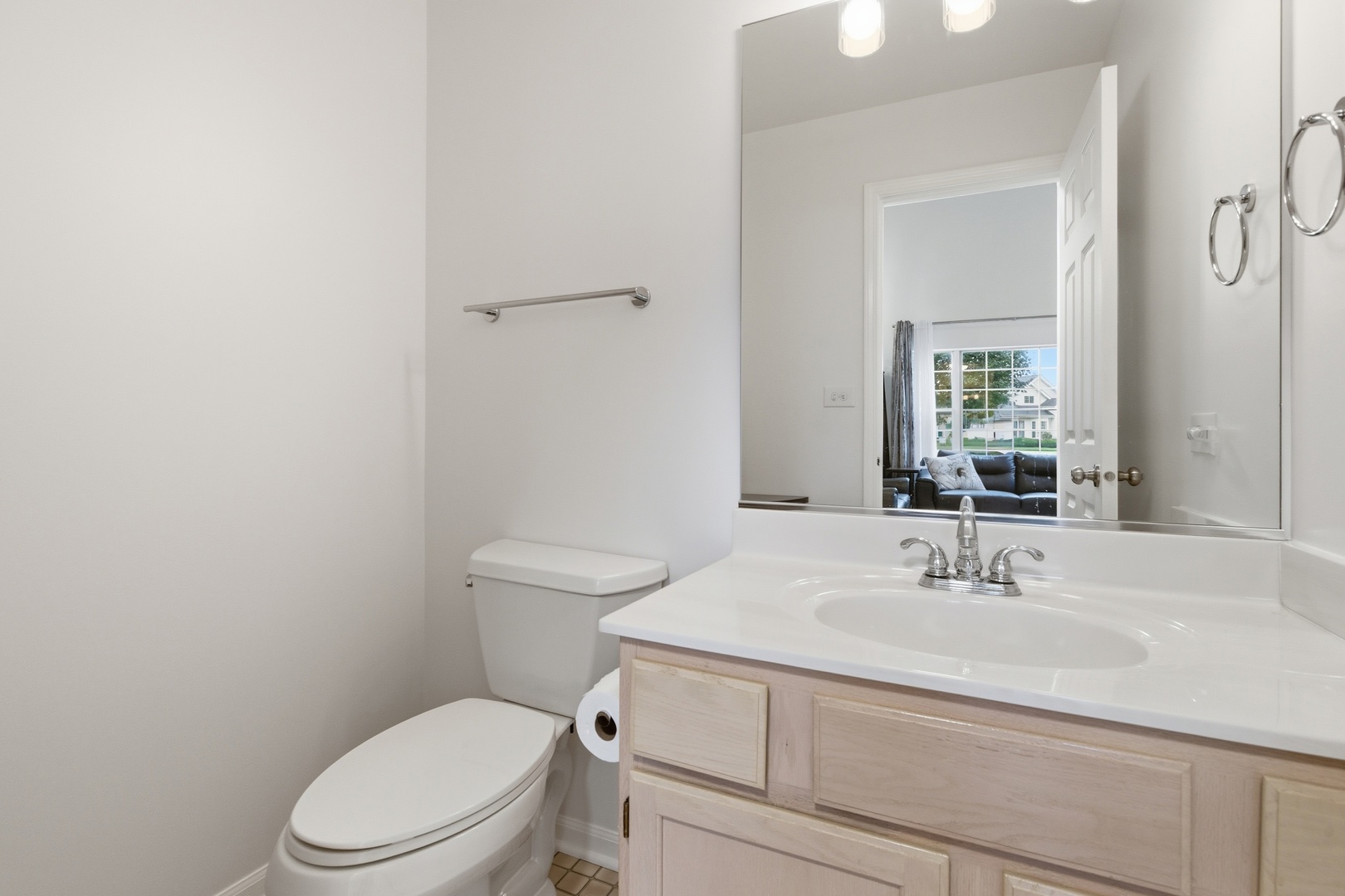 1411 Clybourne Street, Unit 11E Batavia, IL 60510 - Photo 10 of 34 a bathroom with a sink toilet and vanity