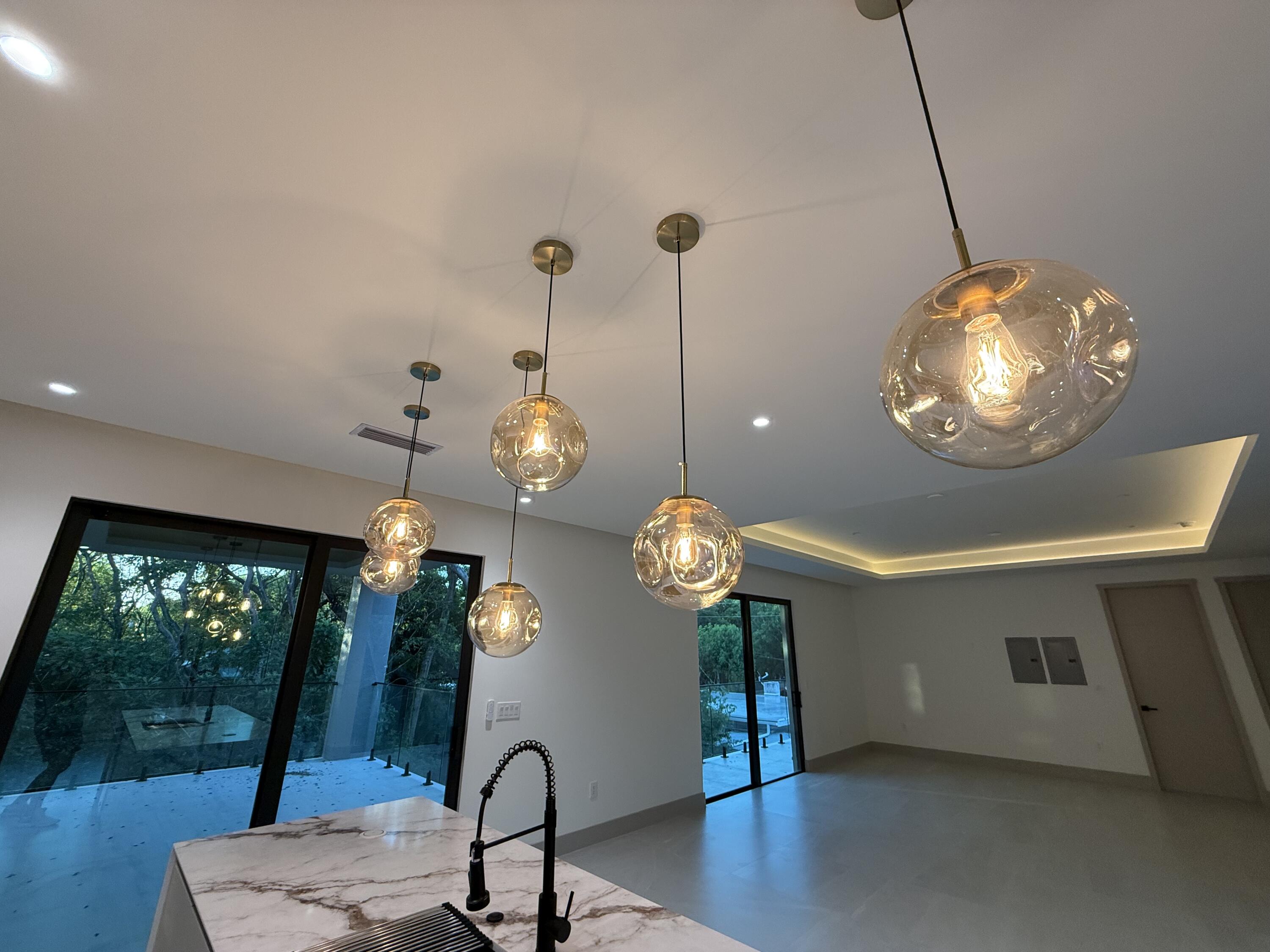 109 Point Pleasant Drive Key Largo, FL 33037 - Photo 13 of 58 a view of a dining room with furniture wooden floor and chandelier