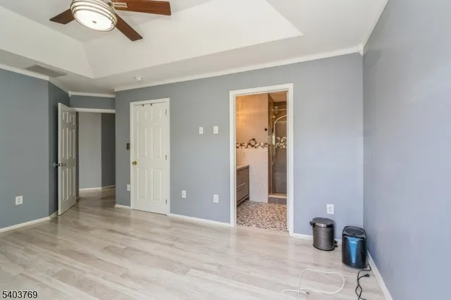 a view of a room with wooden floor and closet
