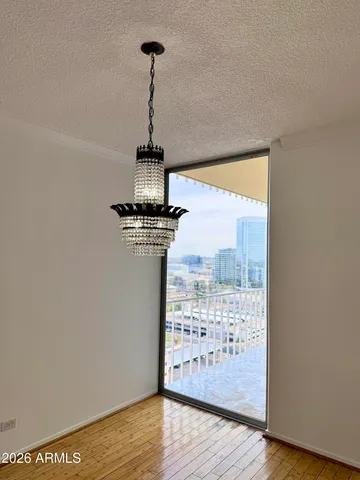 a view of a room with wooden floor