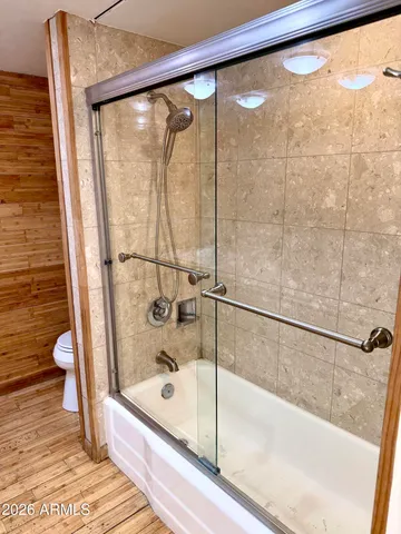 a bathroom with a bathtub and a shower