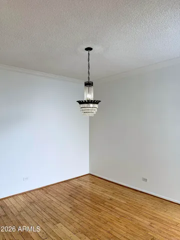 a view of a room with a sink and wooden floor