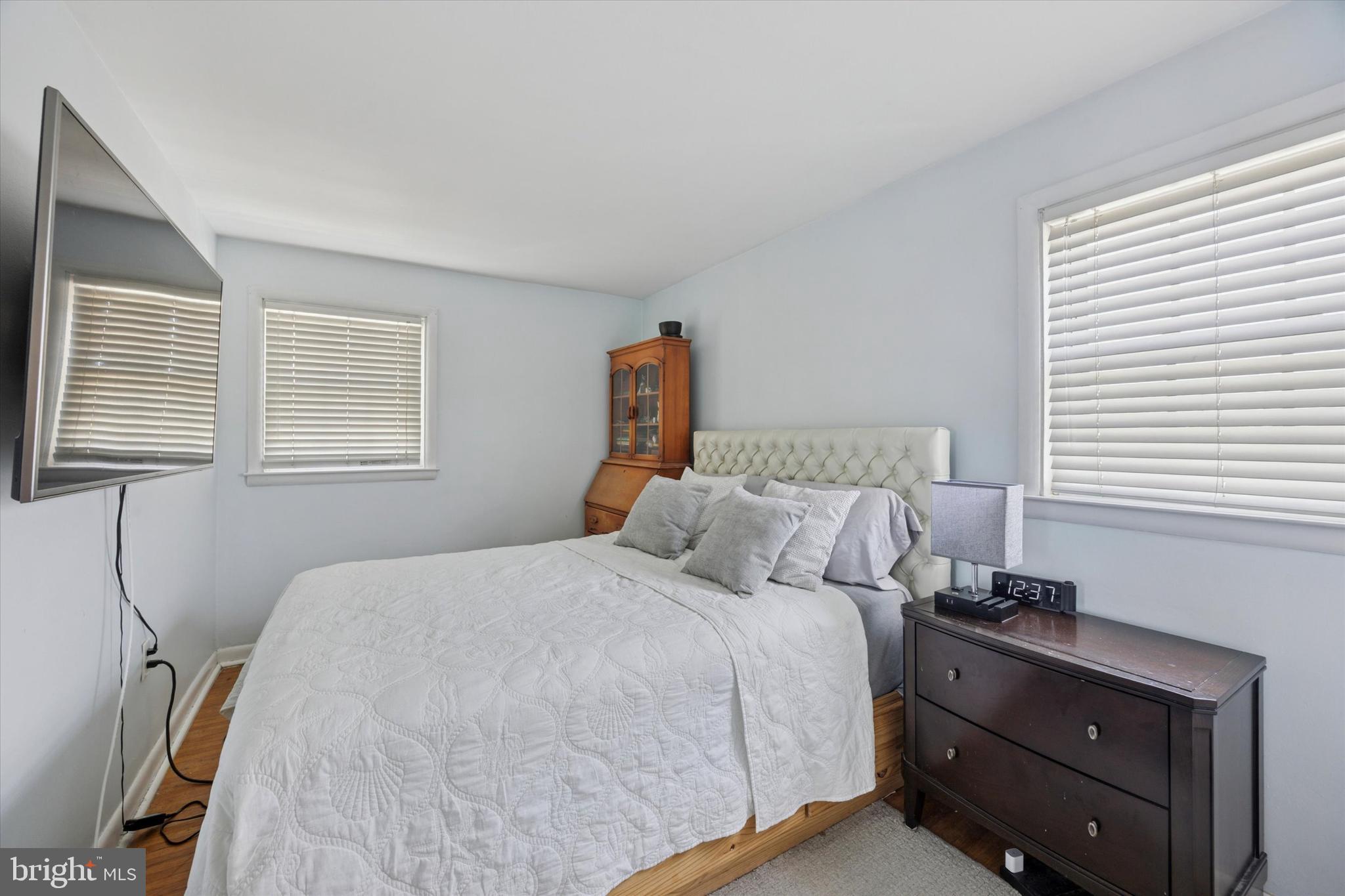 401 Haverford Road Folsom, PA 19033 - Photo 17 of 26 a bedroom with a bed and a window