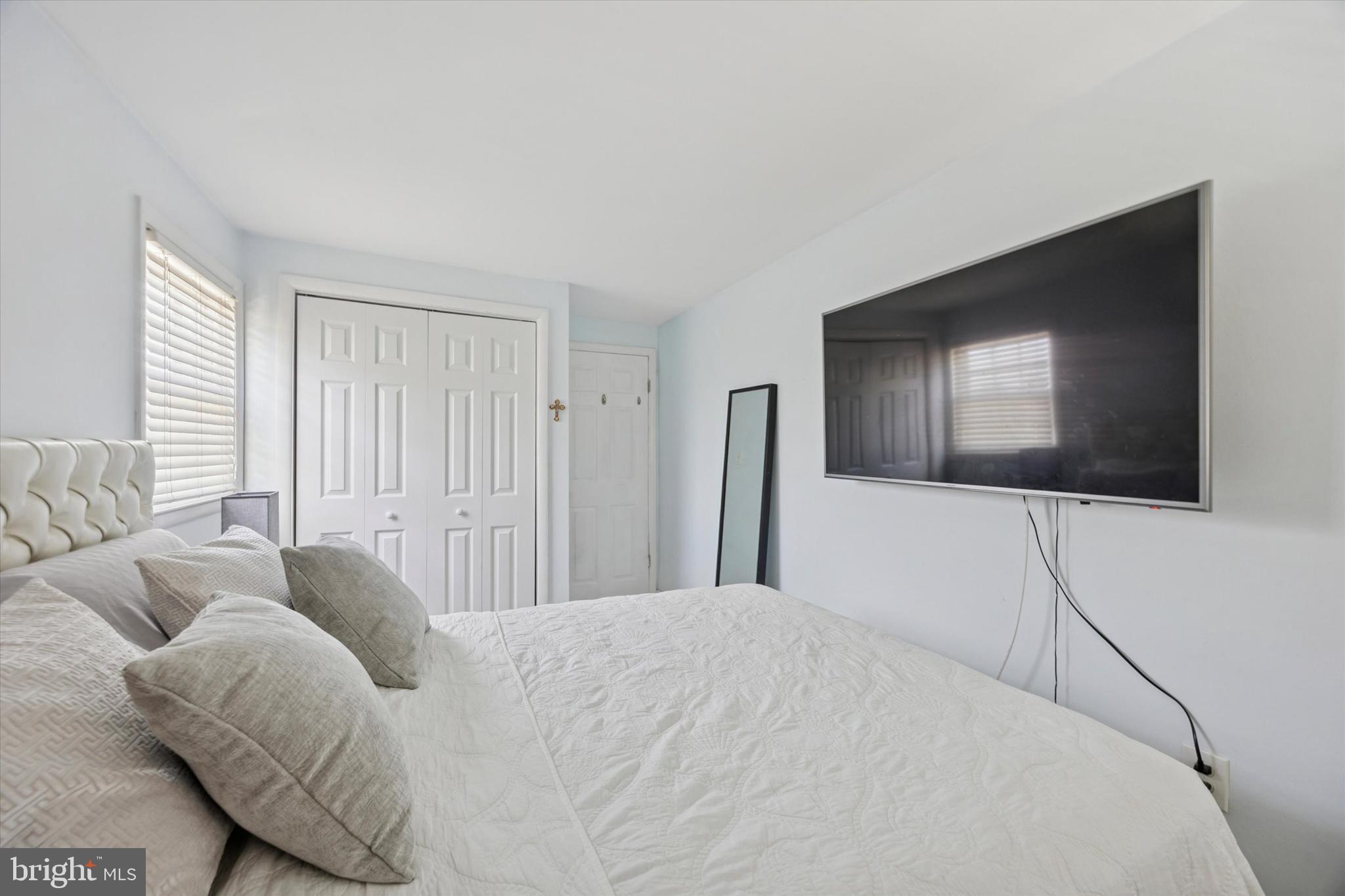 401 Haverford Road Folsom, PA 19033 - Photo 19 of 26 a bedroom with a bed and a television