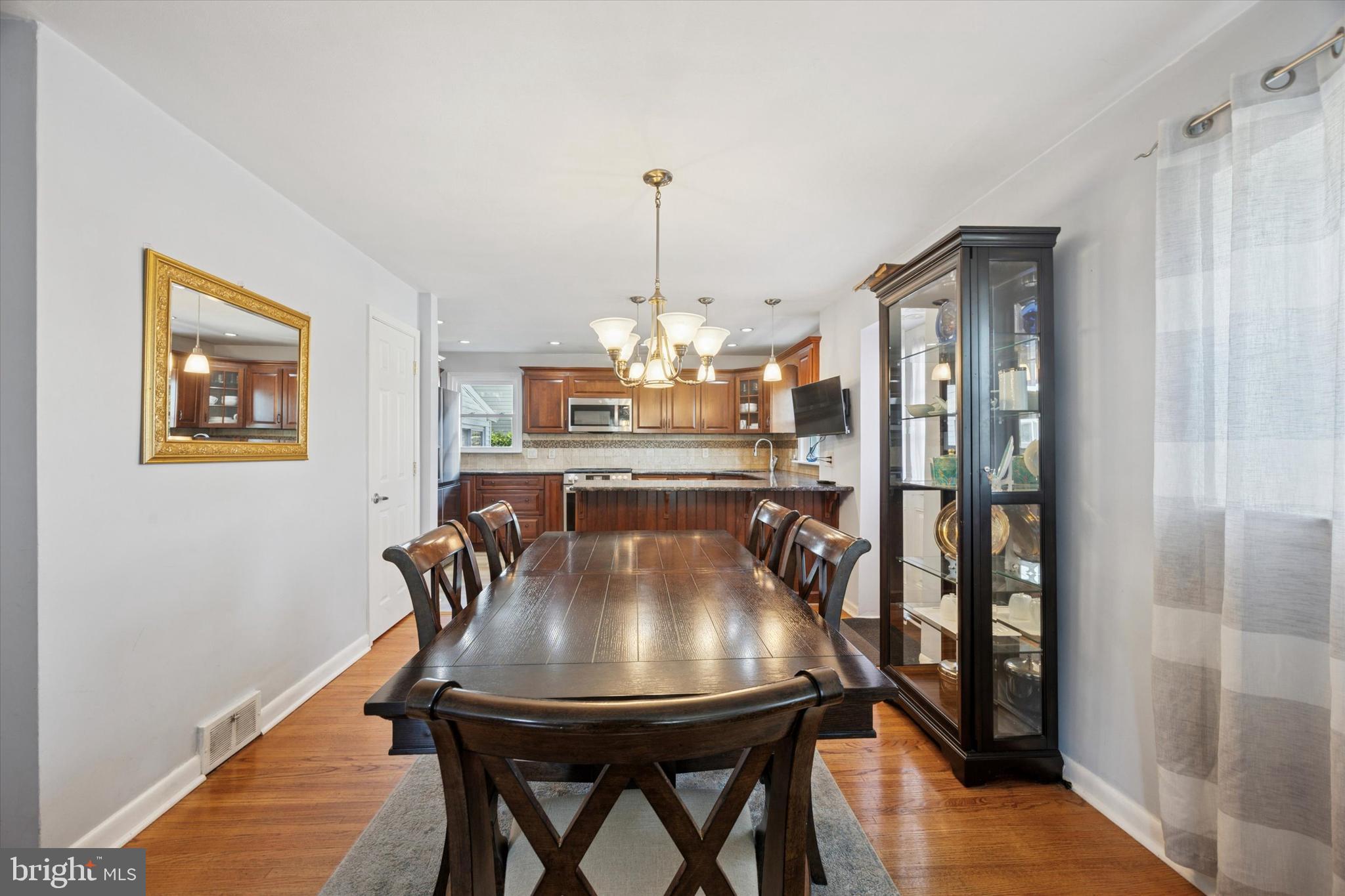 401 Haverford Road Folsom, PA 19033 - Photo 7 of 26 a view of a dining room with furniture and chandelier