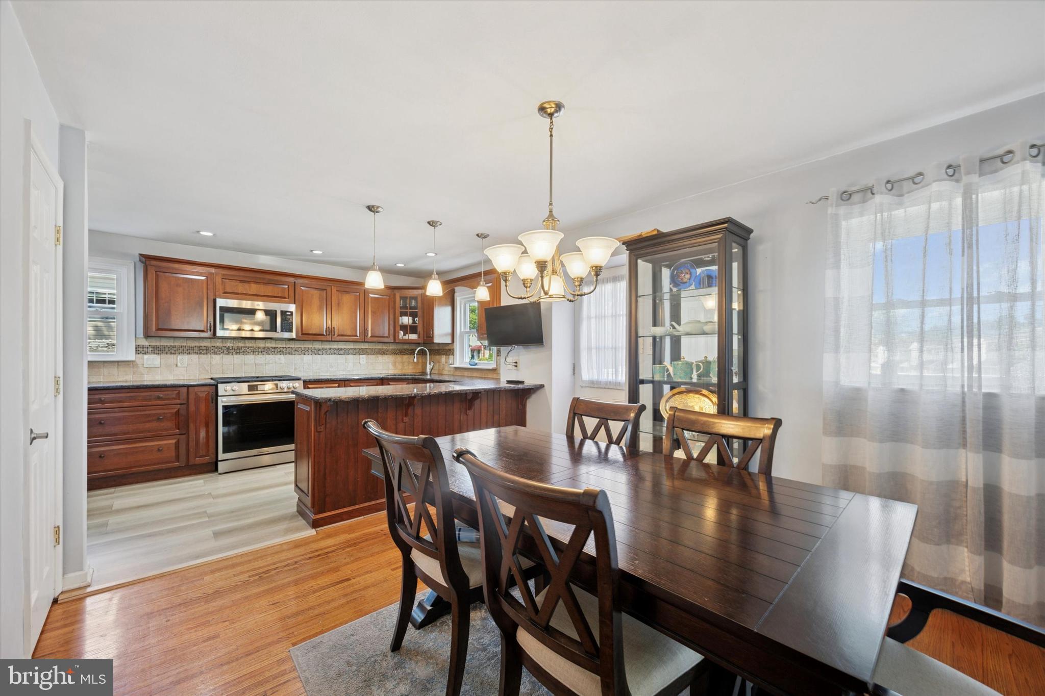 401 Haverford Road Folsom, PA 19033 - Photo 8 of 26 a view of a dining room with furniture window and wooden floor
