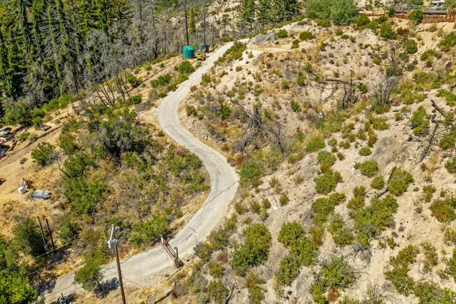 a view of a field with a mountain in the background