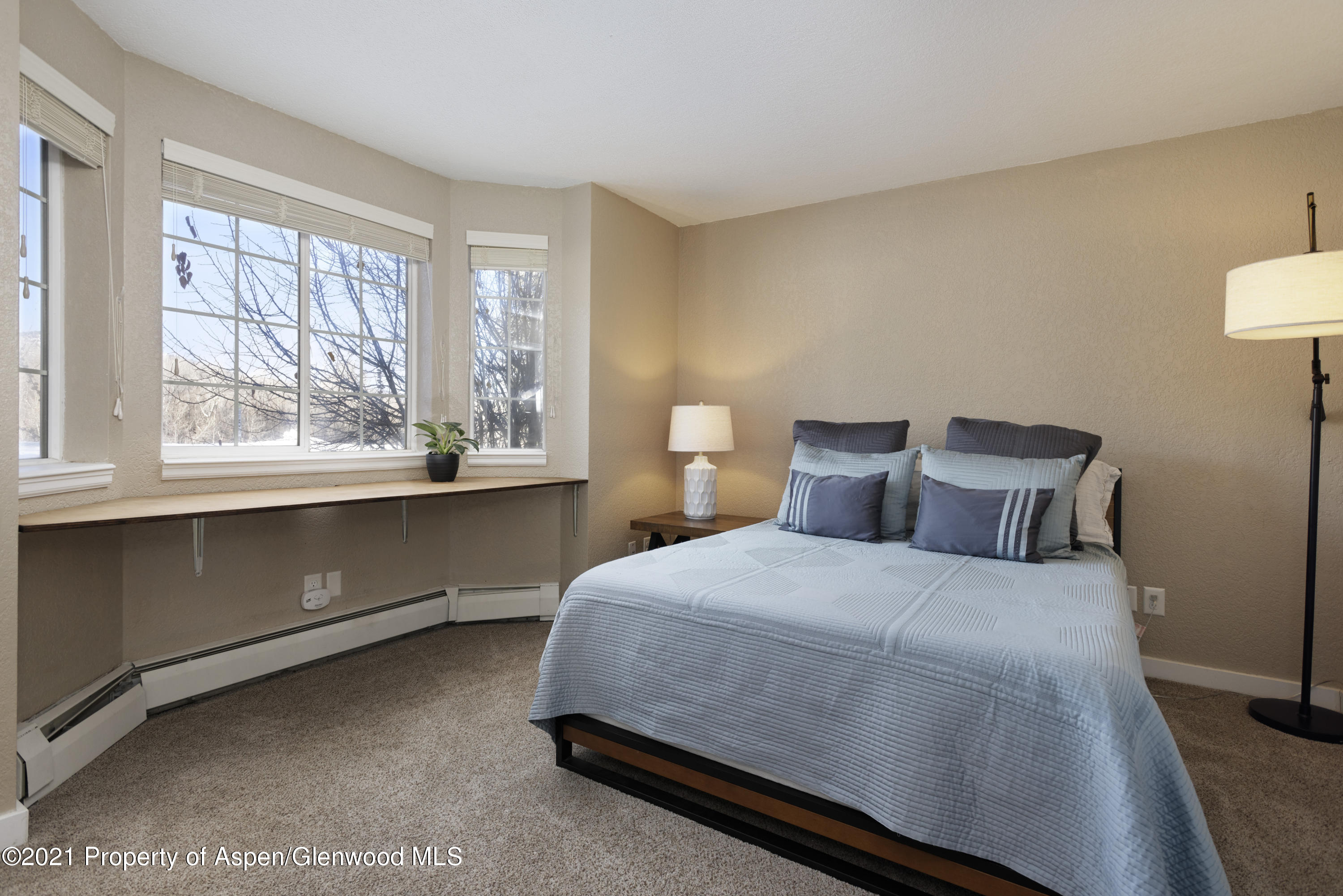 8104 Elk Lane Basalt, CO 81621 - Photo 7 of 13 a bedroom with a bed and a large window