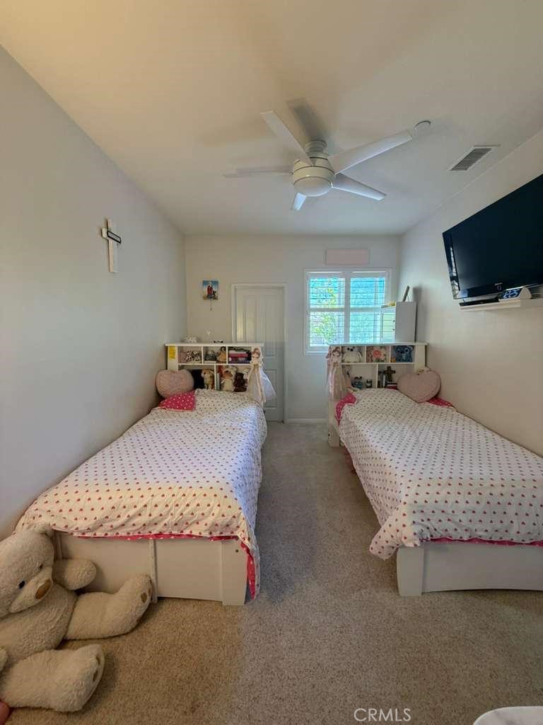 2931 Esperanza Way, Unit B Simi Valley, CA 93063 - Photo 40 of 49 a bedroom with a bed and window