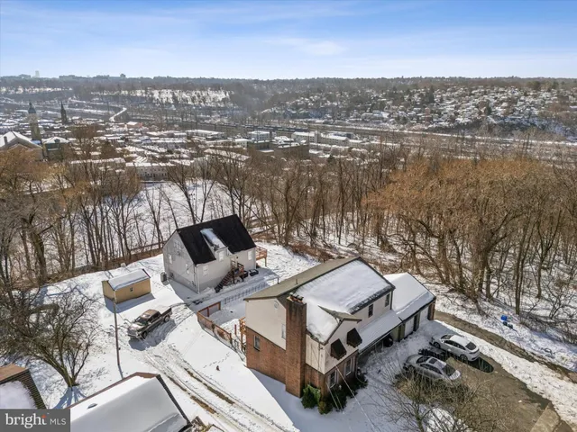 an aerial view of a house with outdoor space