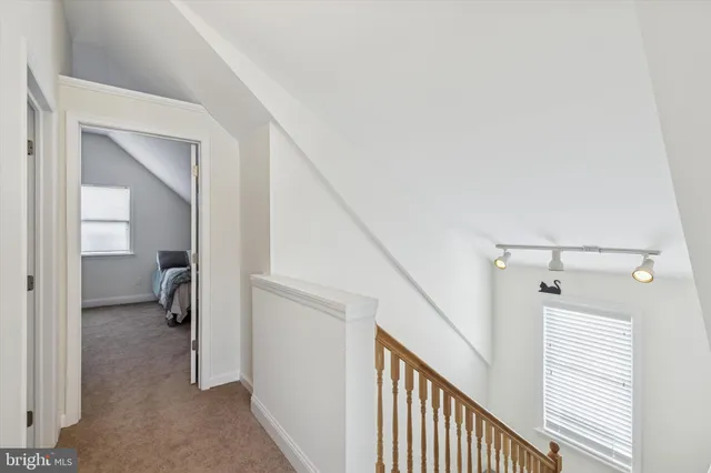a view of bedroom with furniture and windows