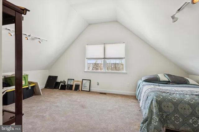 a bed room with a bed and a couch